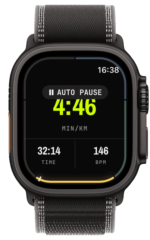 The watch mid-run with the AUTO PAUSE capsule over the pace, time and heart-rate screen